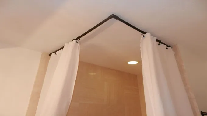 where to hang a shower curtain rod